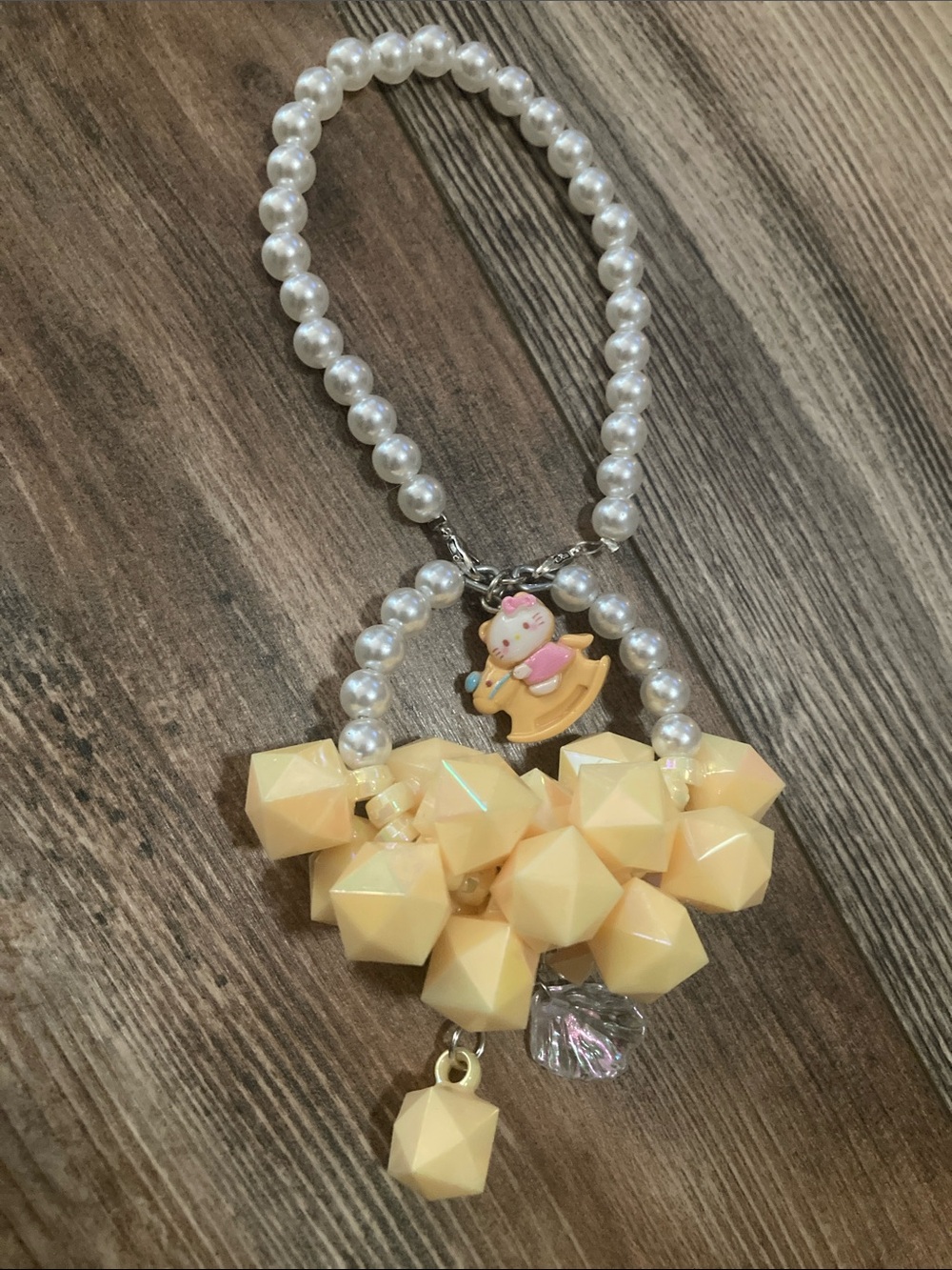 Baby Hello Kitty Rocking Horse Yellow Atone Pearl Bag Charm Wristlet